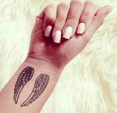 Gorgeous wings wrist tattoo