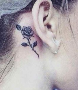 Small tattoo design for girls - rose behind his ear