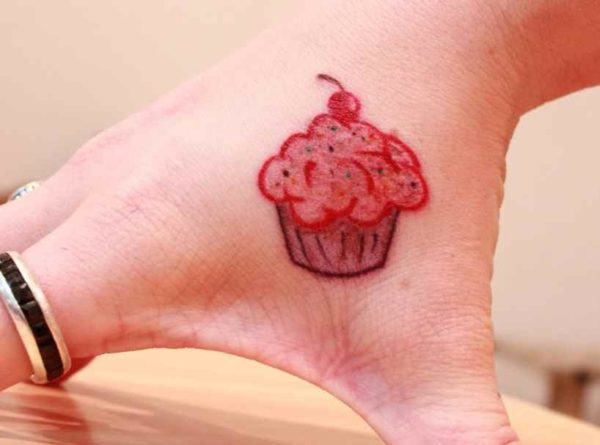 Cute cupcake tattoo on hand