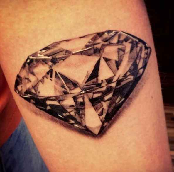 Black tattoo diamond on hand