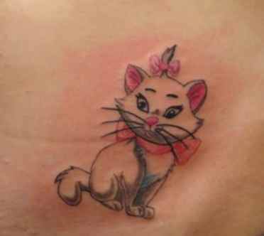 Tattoo of a kitten with a bow