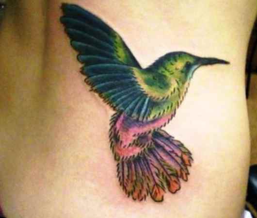 Hummingbird tattoo on side