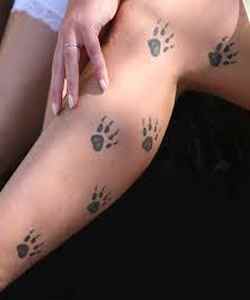 Paws up the leg tattoo