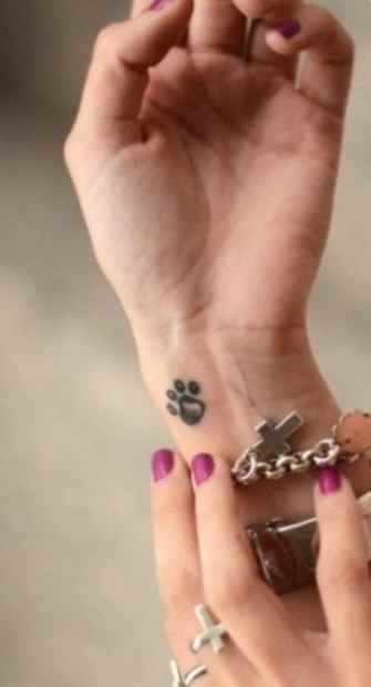 Purple nails and dog tattoo