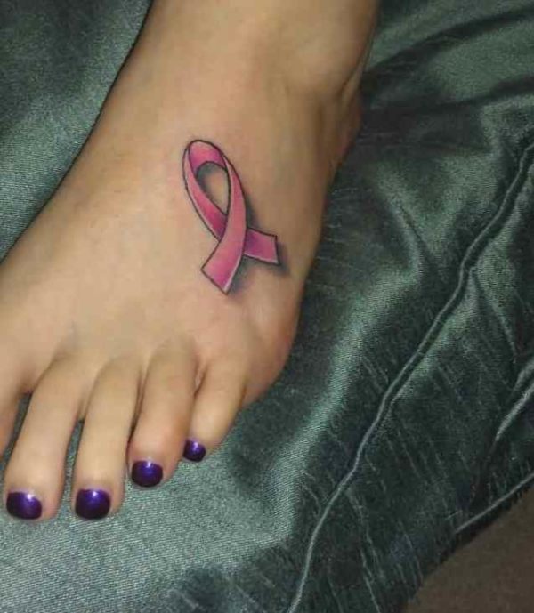 Ribbon tattoo on foot