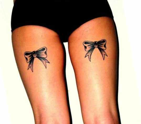 Ribbon tattoo on thighs meaning