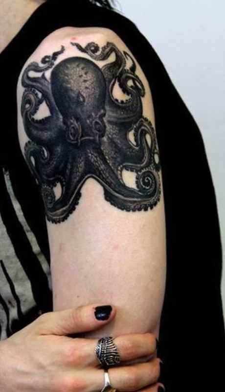 Black arms octopus tattoo