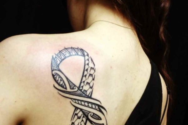 Breast cancer ribbon tribal tattoo