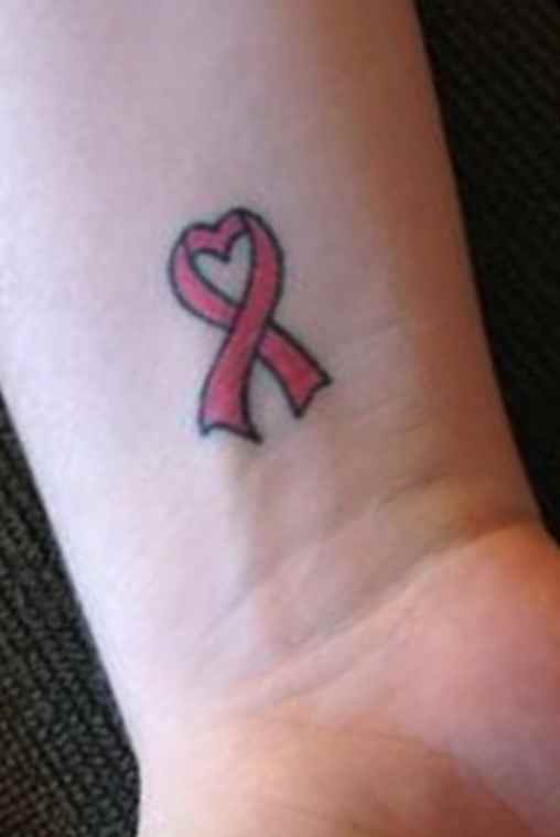 Cancer ribbon tattoos on the wrist