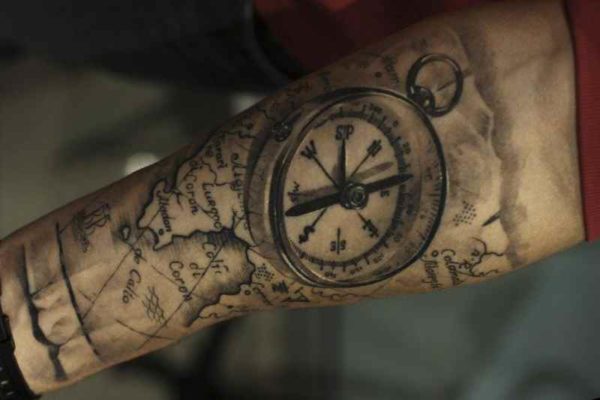 Tattoo on forearm % compass