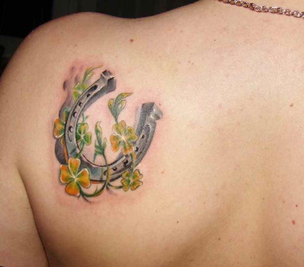 Yellow and green flowers with horse shoe tattoo