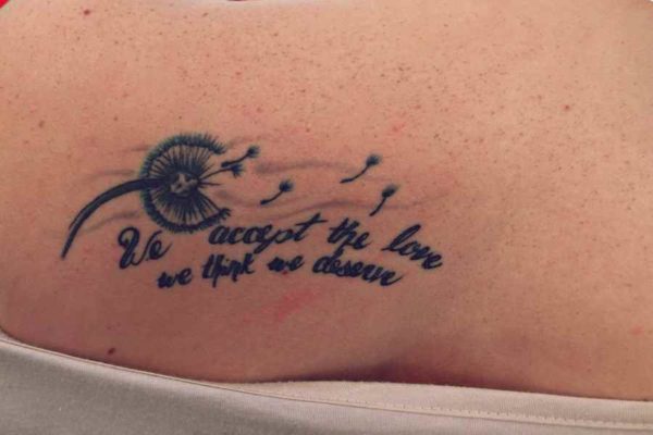Tattoo of flowers and a quote
