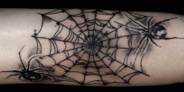 Tattoo spider web on his elbow