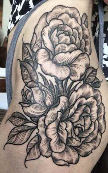 Flower tattoo on thigh
