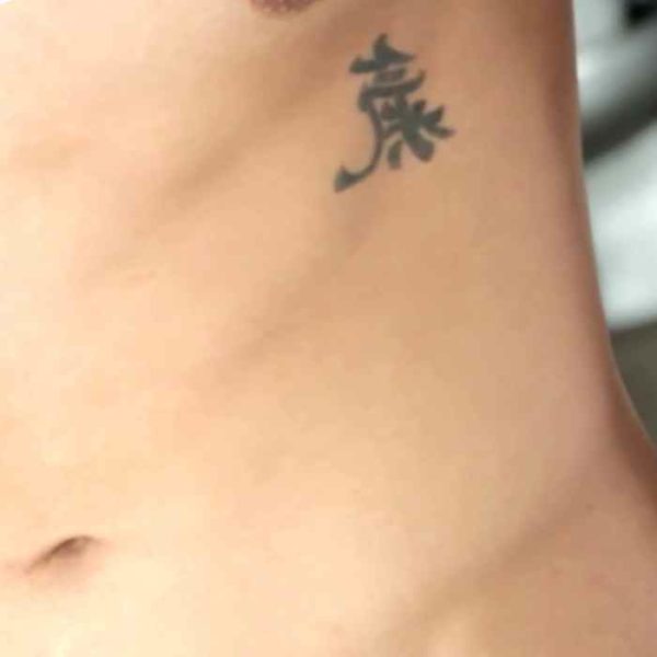 Small tattoo on the ribs