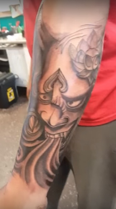 Buddha tattoo on hand