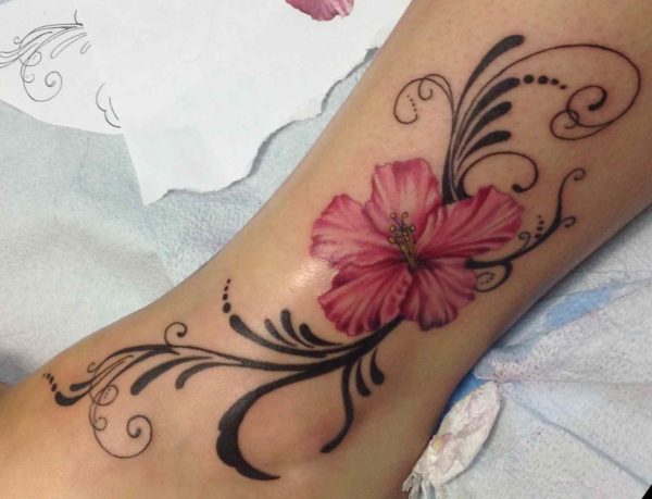Flowers up ankle tattoo