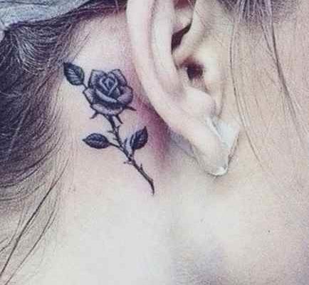 Small tattoo design for girls - rose behind his ear
