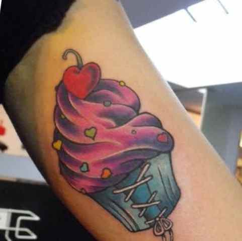 Cupcake with cherry topping tattoo