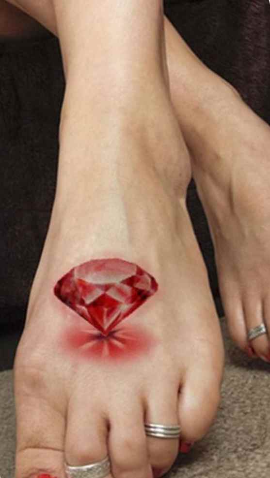 Red diamond tattoo on the foot