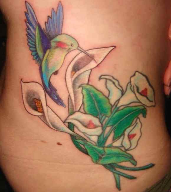 Hummingbird tattoo with flowers-on side