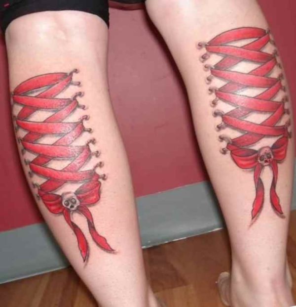 Ribbon tattoo back at the legs