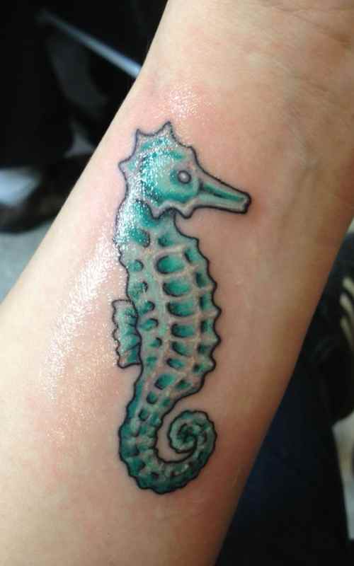 Seahorse wrist tattoo