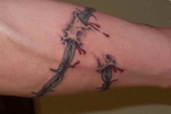 Dripping blood barbed wire tattoo