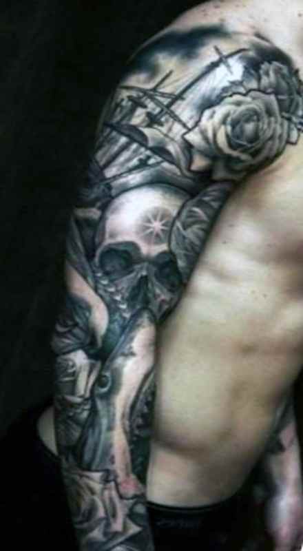 Skull and tribal sleeve tattoos