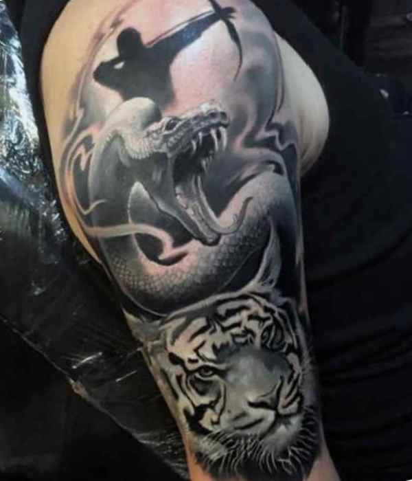 Male tattoo archer, dragon and tiger