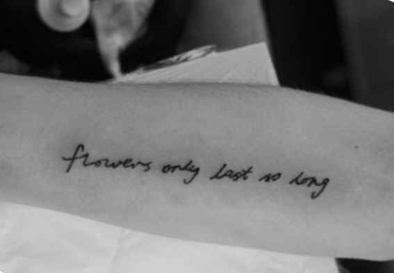 Quote tattoo on the arm
