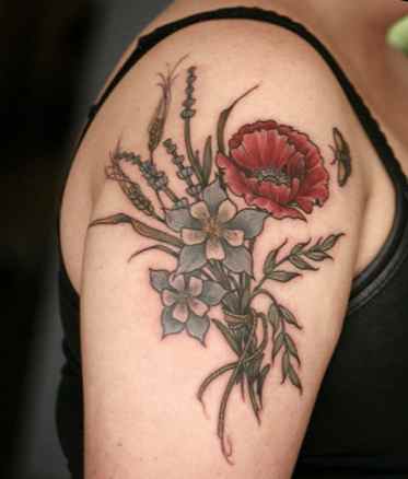 Flower tattoo over shoulder