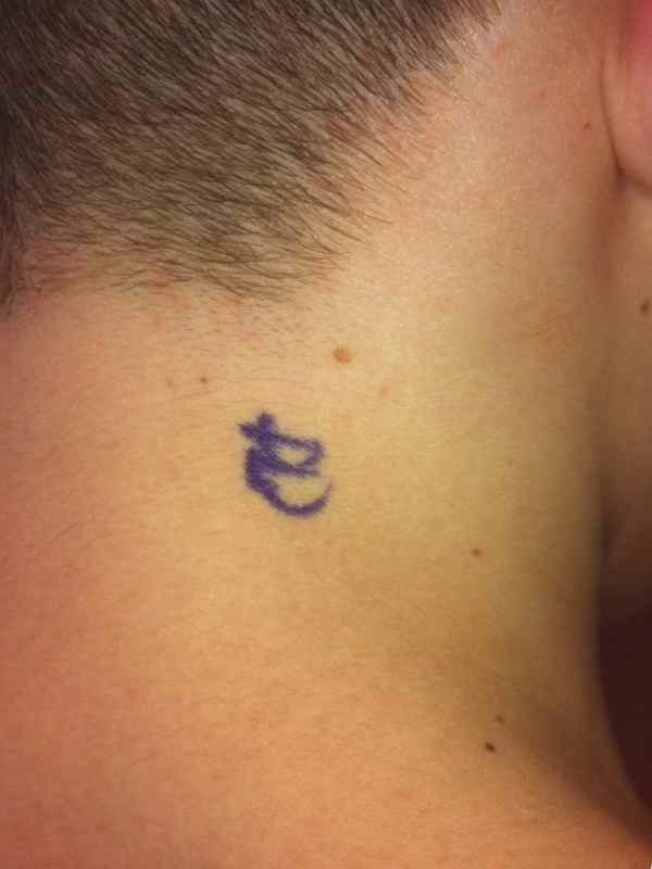 Small tattoo on the neck