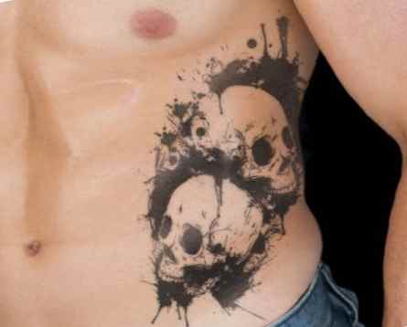Skull tattoo on his side