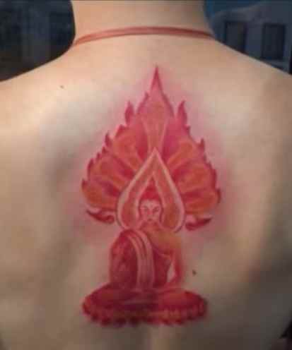 Red Buddha on female back