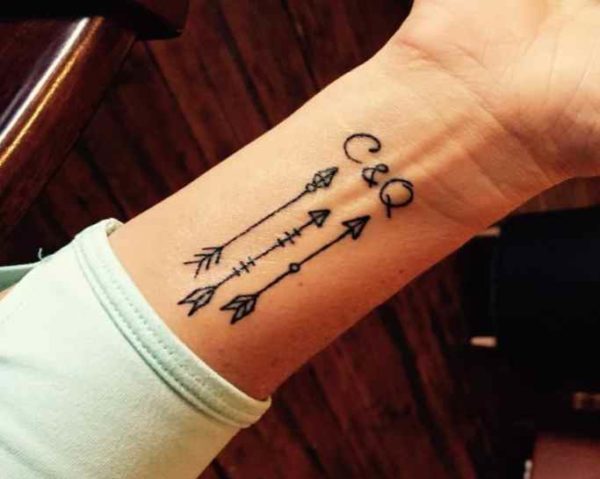 Arrow tattoo on wrist