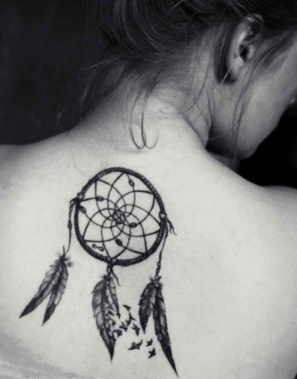 Dreamcatcher tattoo on her back