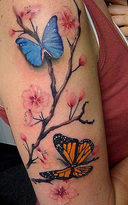 Feminine tattoo idea flowers and butterflies